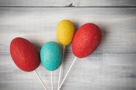 Easter decorative eggs over wooden backgroundの写真素材