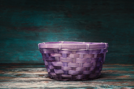 Empty handmade basket over vintage rustic backgroundの写真素材