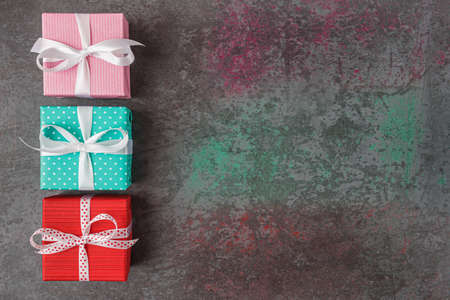 Gift boxes on dark stone background with copy space