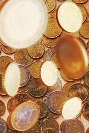 Business concept with Euro coins falling from aboveの写真素材