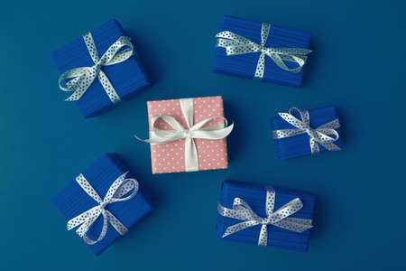 One pink and blue gift boxes with spotted bows