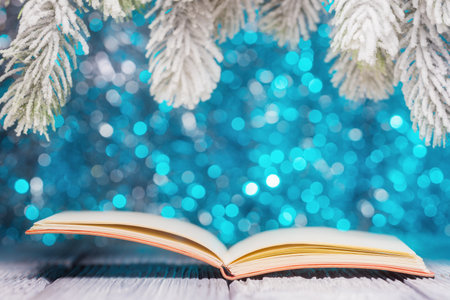 Open book over festive Christmas backgroundの写真素材