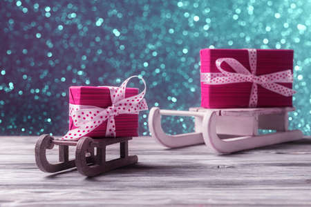 Red gift boxes on Santaâs sleighs. New Year and Xmas cardの写真素材