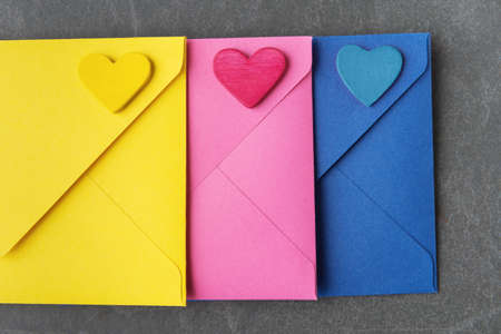 Multicolor Envelopes and hearts on grey background. Valentine âs Day greetingの写真素材