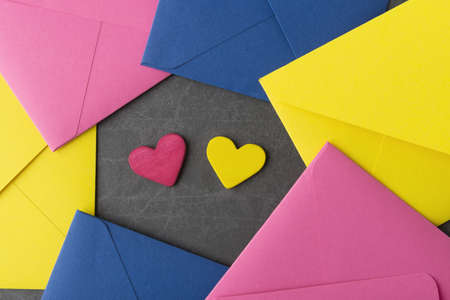 Multicolored envelopes and decorative Valentineâs heartsの写真素材