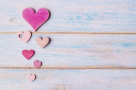 Various decorative hearts on old wooden background with copy space. Valentineâs day conceptの写真素材
