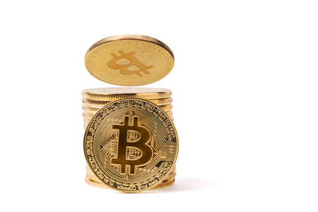 Golden bitkoins stack isolated on whiteの写真素材