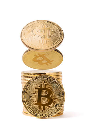 Golden bitkoins stack isolated on whiteの写真素材