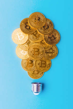 Bitcoins arranged in a shape of light bulbの写真素材