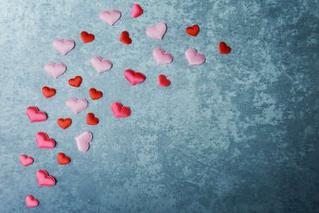 Decorative hearts on blue stone background. Valentinesâ day greeting cardの写真素材