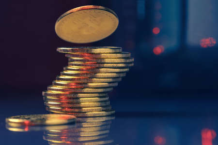 Bitcoins stack over dark abstract background with copy space. Cryptocurrency and blockchain conceptの写真素材