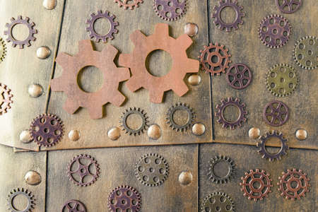 Top view of gears on metal background with rivets. Steampunk styleの写真素材