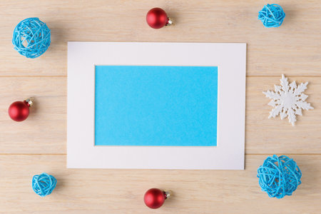Christmas decoration and frame with blank blue background with copy space. Xmas and New Year backgroundの写真素材