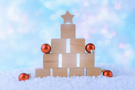 Christmas background with Xmas decoration and wooden blocks arranged as New Year treeの写真素材