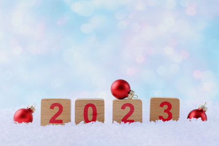 Christmas background with Xmas decoration and wooden blocks with number 2023の写真素材