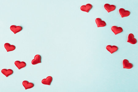 Valentineâs day background with decorative hearts on light blue background. Valentines day greeting card templateの写真素材