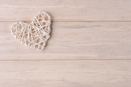 Craft Valentines hearts on light wooden background. Valentineâs day greeting cart templateの写真素材