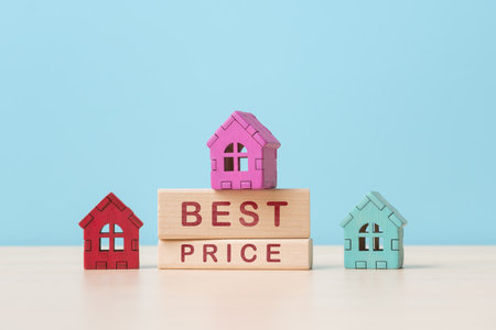 Houses models on wooden blocks with capture Best Price. Real estate buying conceptの写真素材