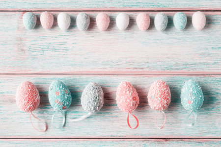 Set of decorative Easter eggs on wooden background with copy space. Easter greeting conceptの写真素材