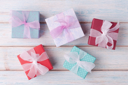 Various gift boxes on wooden backgroundの写真素材