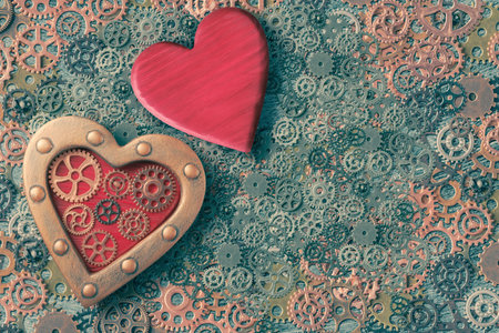 Two steampunk decorated hearts on a background of gears. Valentine's Day concept in steampunk styleの写真素材