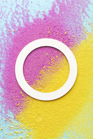 A white circle is on a yellow and pink backgroundの写真素材
