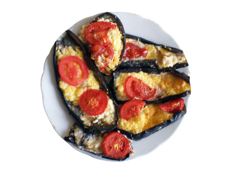 Baked eggplant with tomato and cheese on a white backgroundの写真素材