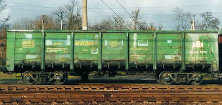 A car, a freight train, standing on the railway tracks of the provincial Ukrainian city of Volnyanskの写真素材