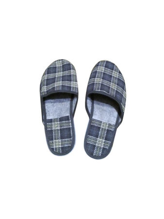 Homemade striped gray slippers on a white backgroundの写真素材