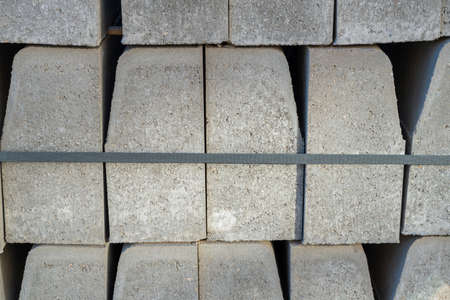 Pallet with concrete curbs for sidewalk construction