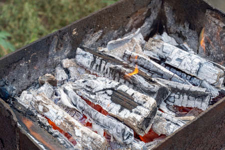 smoldering charcoal close-up in an old brazierの写真素材