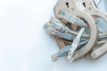 Bunch of the network wires locked with the handcuffs