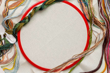 Embroidery frames, embroidery stitching kit with color threads and canvas background with copy space
