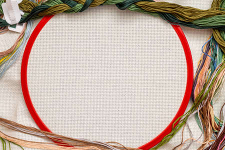 Embroidery frames, embroidery stitching kit with color threads and canvas background with copy spaceの写真素材