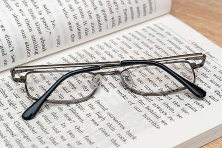 Glasses for reading on the book close up
