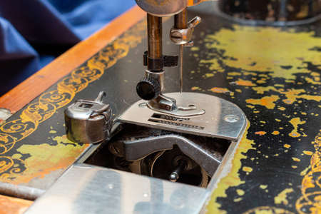 Stitching, sewing on an old, retro, vintage sewing machine close upの写真素材