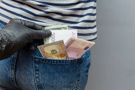 money, banknotes found in pocket with hand in glove during a police search