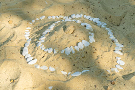 yellow sand background with stones close up