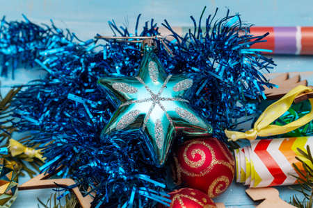 wrapping gift on the background of wrapping paper and satin ribbons Christmas toys. Holidays preparations concept.の写真素材