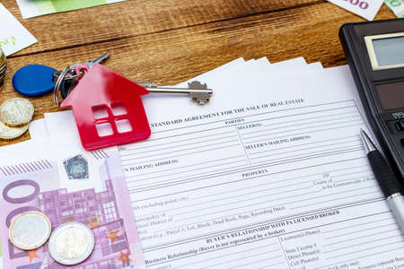 House, home, property, real estate purchase buying sale contract agreement pen money coins keys...