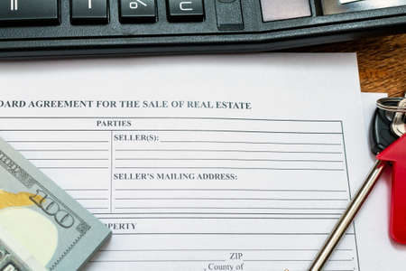 House, home, property, real estate purchase buying sale contract agreement pen money coins keys wooden background, expenses, buying, investment, finance, savings, concept close up selective focusの写真素材