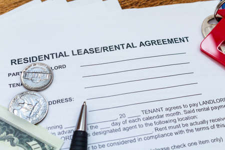 House, home, property, real estate lease rental contract agreement pen money coins keys wooden...