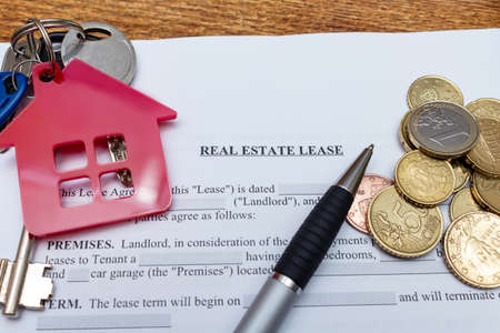 House, home, property, real estate lease rental contract agreement pen money coins keys wooden background, expenses, buying, investment, finance, savings, concept close up selective focusの写真素材