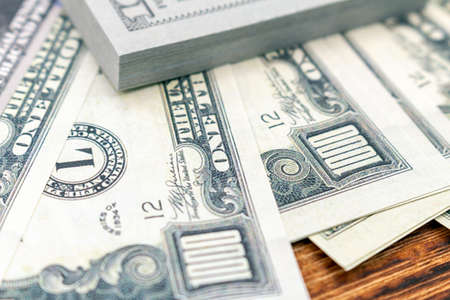 Pack of dollars banknotes and coins background finance economy currency close up selective focus US currency USDの写真素材