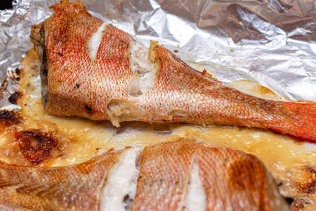 sea bass grouper homemade baked in a foil in the oven