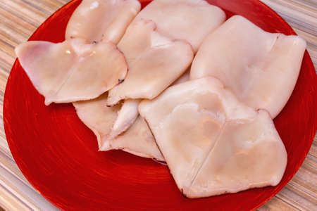 cooking raw squid rings at homeの写真素材