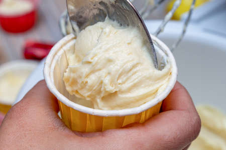 Cooking cupcake muffin raw dough in a formの写真素材