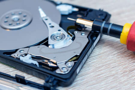 old broken hard disk drives composition in a repair recovery service concept close up selective...