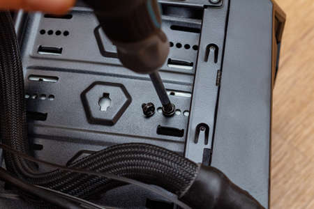 Assembling screwing a personal computer processor in a service. Upgrade repair maintenance.の写真素材