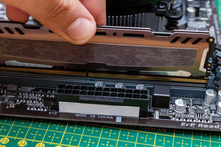 Installing a new RAM DDR memory for a personal computer processor socket in a service. Upgrade...